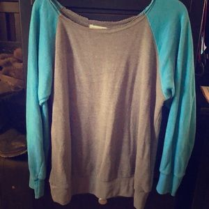 Blue and grey off the shoulder sweatshirt.